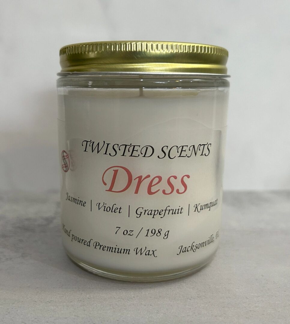 Candle labeled "Dress" by Twisted Scents