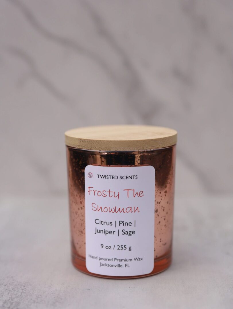 Candle with frosty scent label