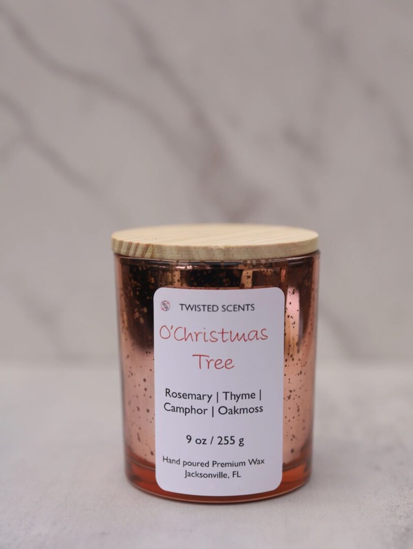 Christmas tree-scented candle in glass jar