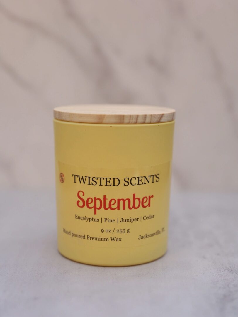 Yellow scented candle with wooden lid