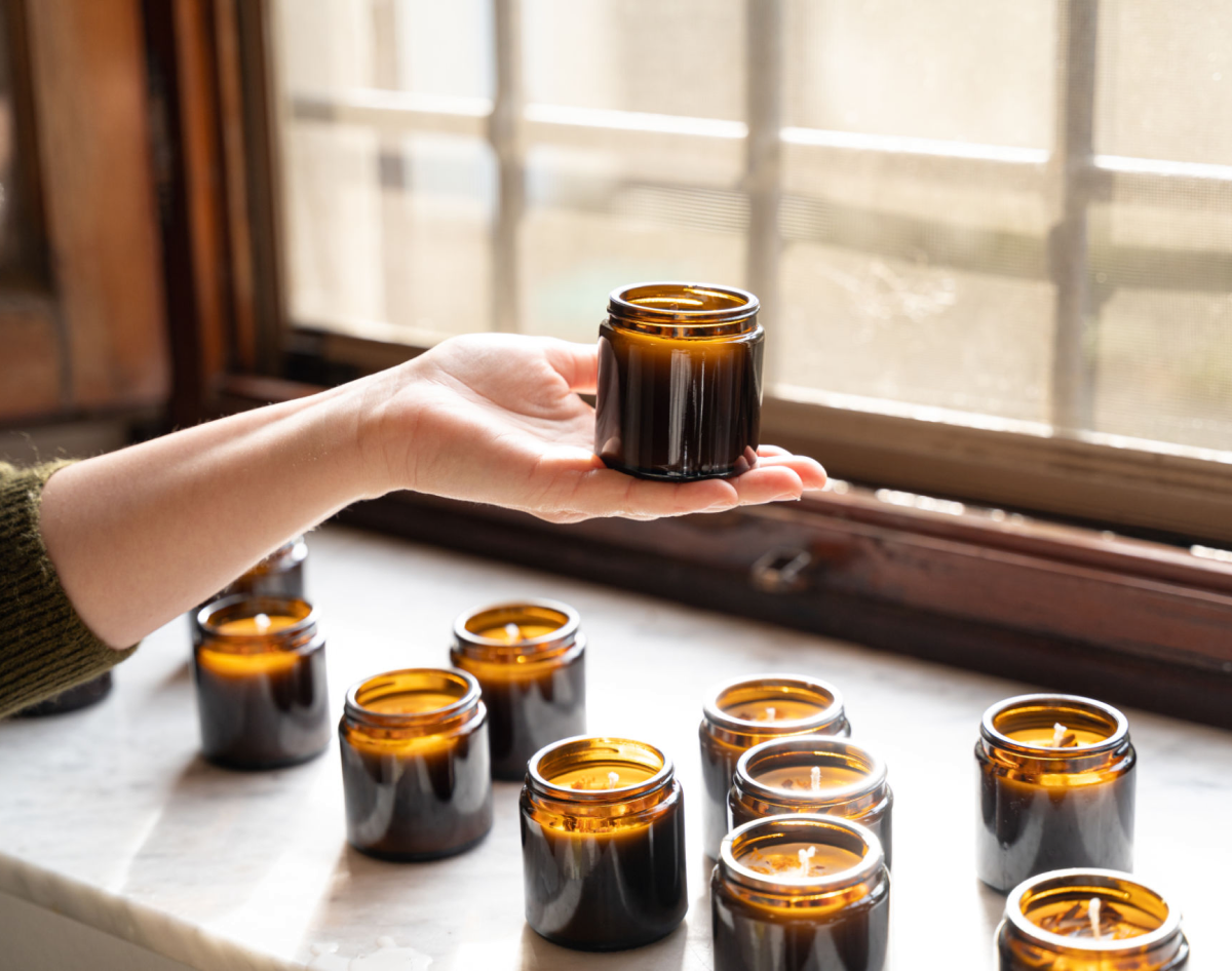 Collection of amber jars on windowsill